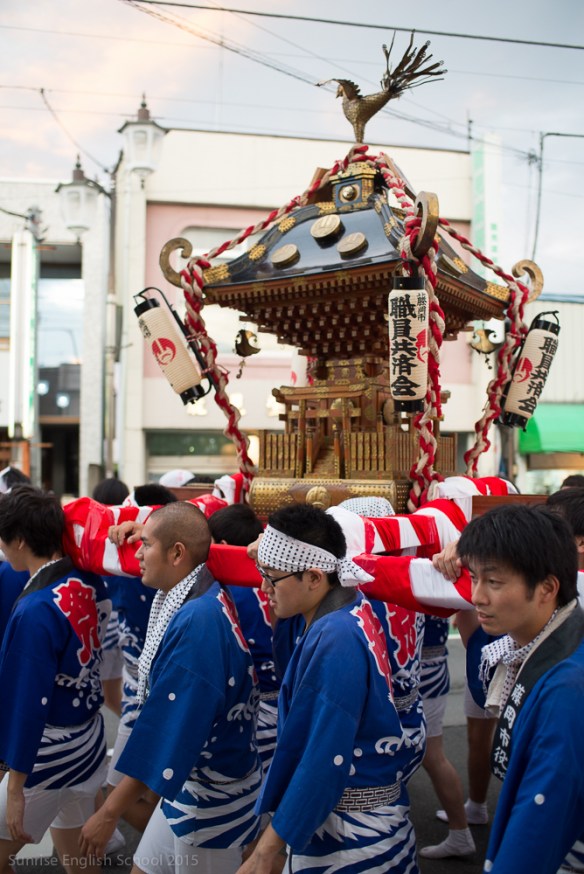 Men carrying a Mikoshi portable shrine.